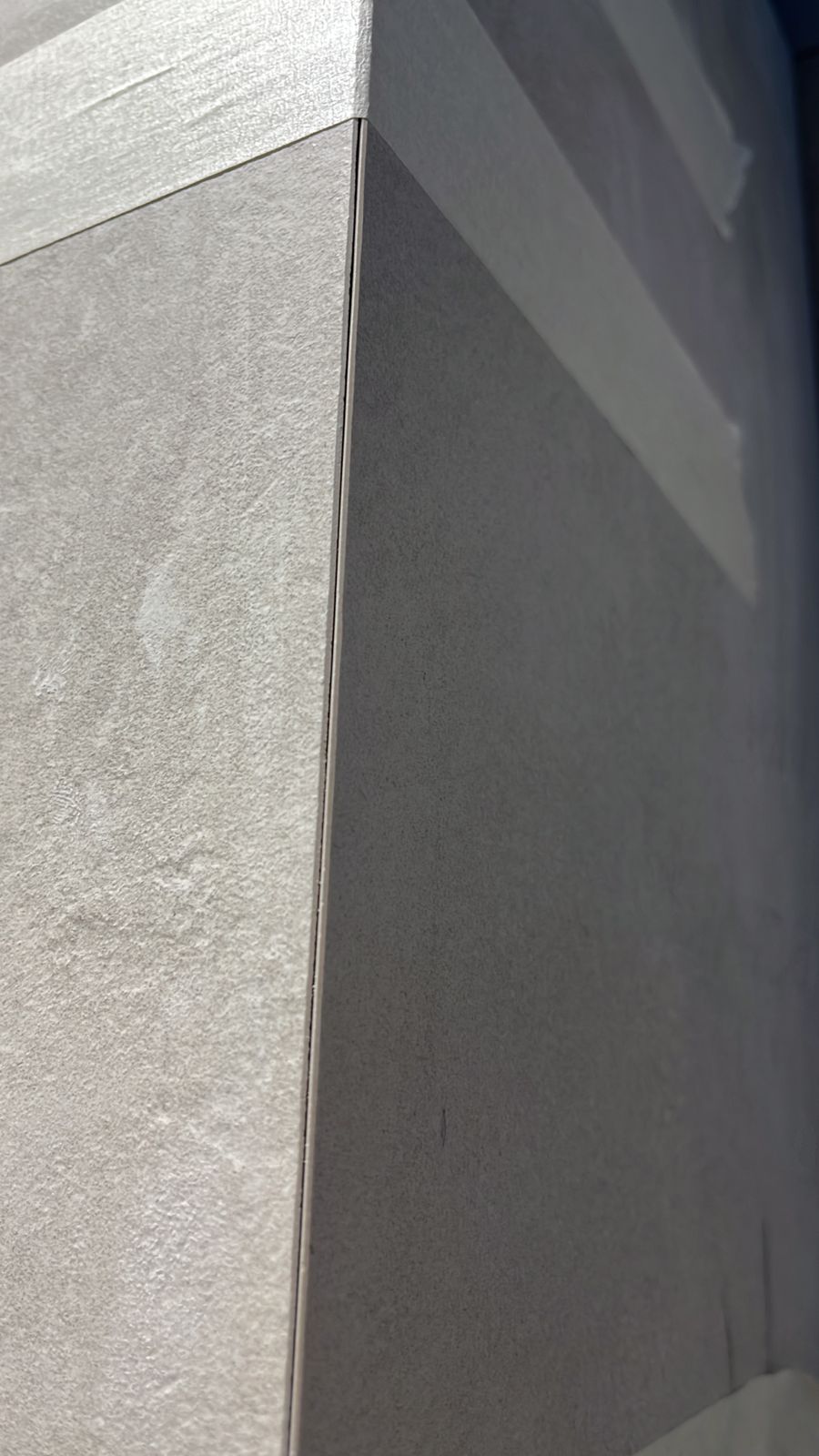 outdoor terrace with 45 degree cut porcelain tiles, professional installation, weather resistant
